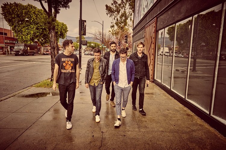 The Arkells band members walking down the sidewalk