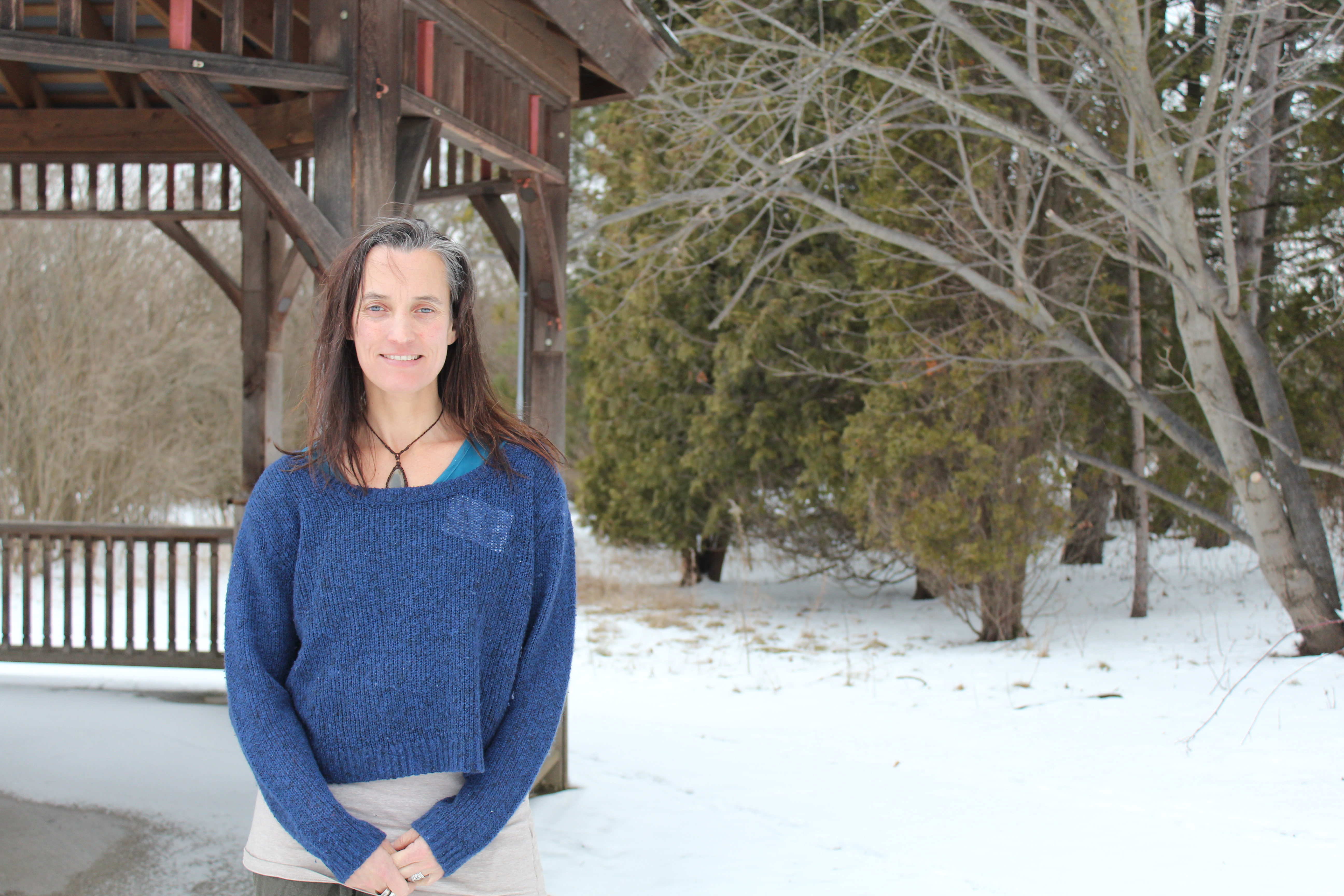 Arlene Slocombe portrait in front of a gazebo in winter.
