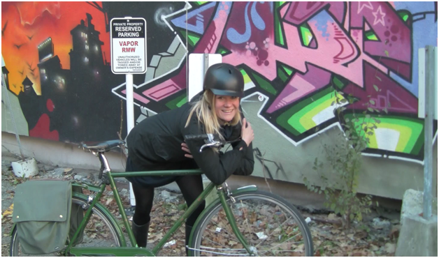 Ashley hugging her bike winter cycling