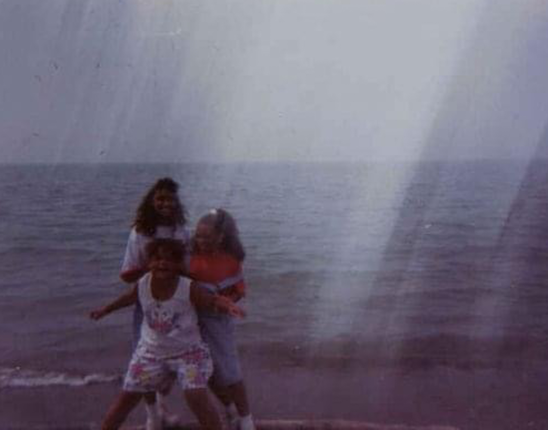 15 Michelle as a child with her sister and cousin at Burns Beach.