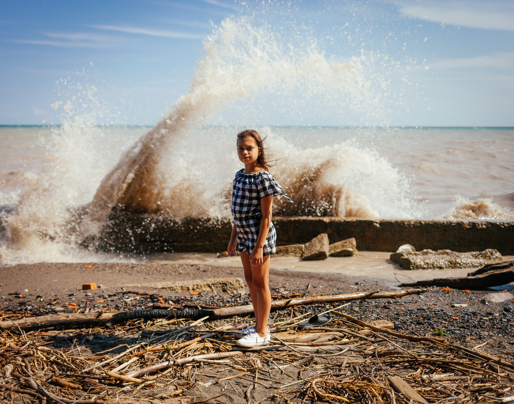 16 Michelle’s daughter stands on the eroded shoreline and what remains of Burns Beach.