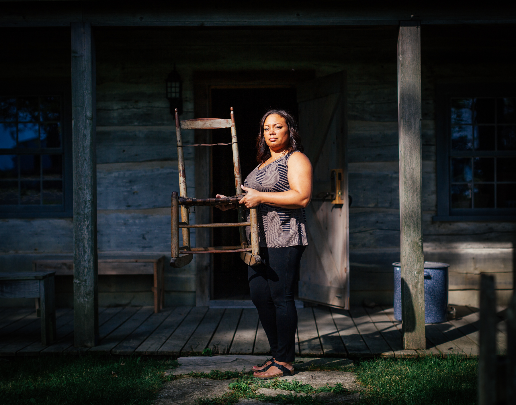 17 Michelle holds her family’s oldest heirloom. This chair now sits in the Colbert-Henderson House (a house from the early settlement built in 1852, that now sits on the museum grounds).